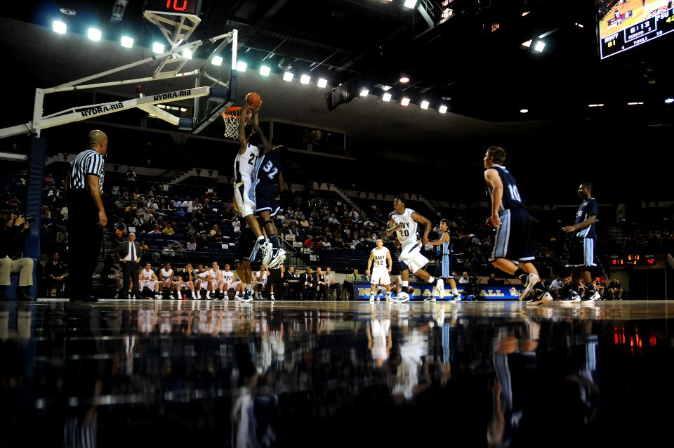 US Navy 111113-N-OA833-002 U.S. Naval Academy forward Worth Smith (^21) dunks the ball during the men's home-opening basketball game at Alumni Hall