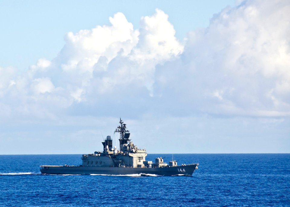 US Navy 111115-N-RI884-093 The Japan Maritime Self-Defense Force helicopter destroyer JS Kurama (DDH 144) maneuvers off the starboard brow of guide