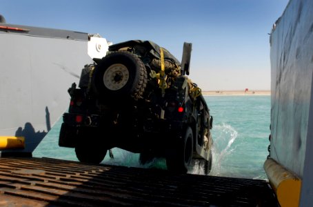 US Navy 111113-N-KA046-134 A Humvee assigned to the 22nd Marine Expeditionary Unit (22 MEU) drives down the ramp of a landing craft utility (LCU)