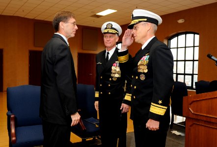 US Navy 111117-N-PO203-359 Rear Adm. Matthew Klunder, incoming chief of naval research, salutes Sean J. Stackley, assistant secretary of the Navy f photo