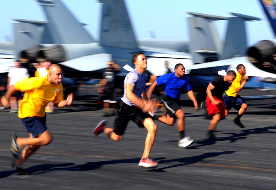 US Navy 111116-N-QL471-318 Sailors participate in a 100-yard dash during a Captain's Cup competition on the flight deck of the aircraft carrier USS