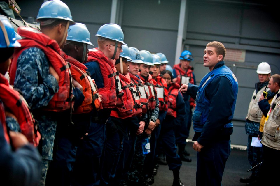 US Navy 111115-N-PB383-006 Boatswain's Mate 2nd Class Garret Renner addresses Sailors aboard the San Antonio-class amphibious transport dock ship U