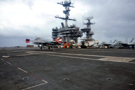 US Navy 111115-N-SF704-244 Rear Adm. J.R. Haley, commander, Task Force 70 and Carrier Strike Group 5, lands his EA-6B Prowler on the flight deck of
