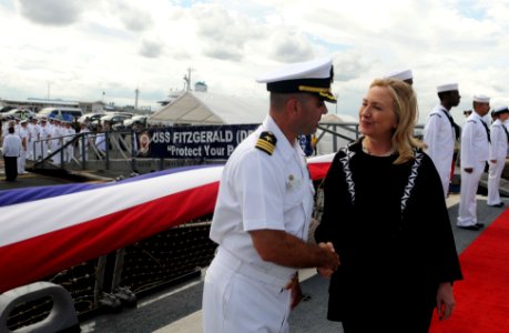 US Navy 111116-N-IO627-065 Secretary of State Hillary Clinton is greeted by Cmdr. Brian T. Mutty, commanding officer of the guided-missile destroye