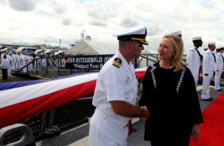 US Navy 111116-N-IO627-065 Secretary of State Hillary Clinton is greeted by Cmdr. Brian T. Mutty, commanding officer of the guided-missile destroye photo