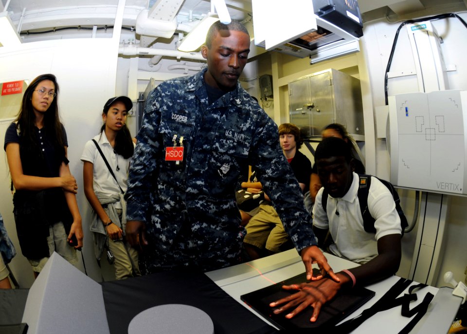 US Navy 111117-N-BK435-010 Hospital Corpsman 2nd Class Andre Cooper demonstrates to the students from Guam High School's Health Team Dynamic's clas