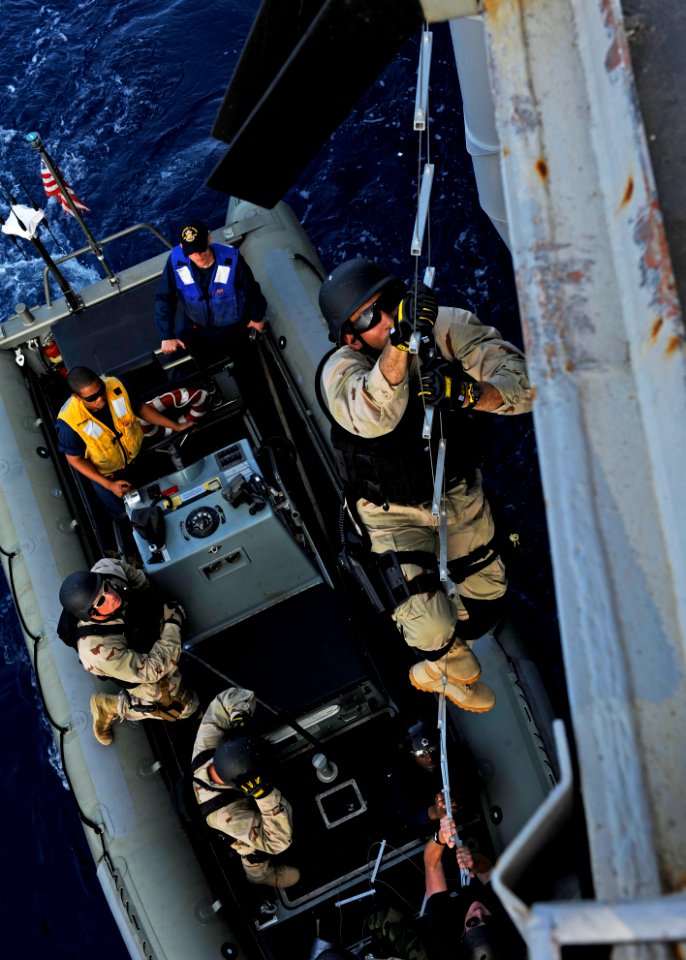 US Navy 111116-N-VH839-128 Sailors climb a ladder during a VBSS drill