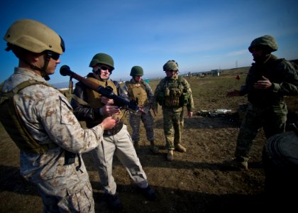 US Navy 111119-N-AC887-003 Marine Corps Staff Sgt. Bow Mattioda demonstrates proper firing of an RPG-7, 85 mm Russian rocket propelled grenade to S