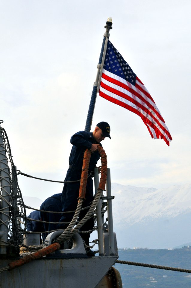 US Navy 111123-N-MO201-094 A Sailor handles a line during mooring operations as the guided-missile frigate USS Samuel B. Roberts (FFG 58) arrives f
