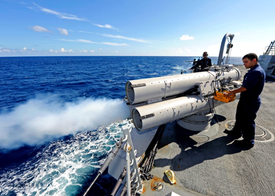 US Navy 111115-N-VH839-001 Gunner's Mate 2nd Class Nelson Sanchez, right, and Sonar Technician (Surface) 2nd Class Thomas Campbell fire an air slug