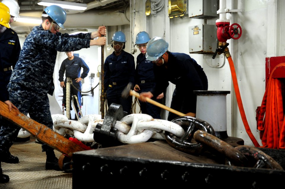 US Navy 111120-N-WA347-176 Sailors rig an anchor chain before dropping the anchor aboard the multi-purpose amphibious assault ship USS Essex (LHD 2