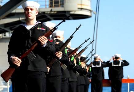US Navy 111117-N-QL471-156 Members of the honor guard aboard the aircraft carrier USS George H.W. Bush prepare to render honors during a burial at