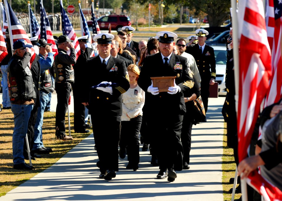 US Navy 111117-N-SN160-125 Service members and civilians pay their respects as Chief Builder Raymond Border's remains are carried to a memorial ser