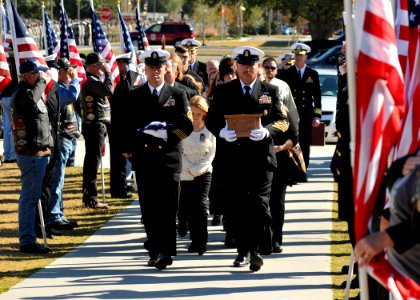 US Navy 111117-N-SN160-125 Service members and civilians pay their respects as Chief Builder Raymond Border's remains are carried to a memorial ser