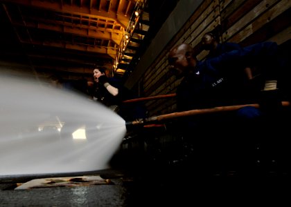 US Navy 111121-N-WJ771-078 Sailors man a fire hose during a crash and salvage drill