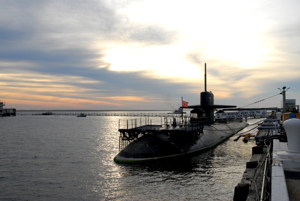 US Navy 111116-N-NK458-001 The Los Angeles-class attack submarine USS Newport News sits pier side at Naval Station Norfolk as the sun sets over the
