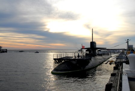 US Navy 111116-N-NK458-001 The Los Angeles-class attack submarine USS Newport News sits pier side at Naval Station Norfolk as the sun sets over the