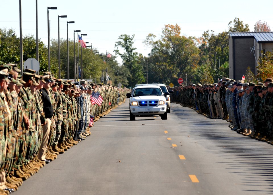 US Navy 111117-N-SN160-006 Service members and civilians pay respect line the road along a funeral procession to pay respects to Chief Builder Raym