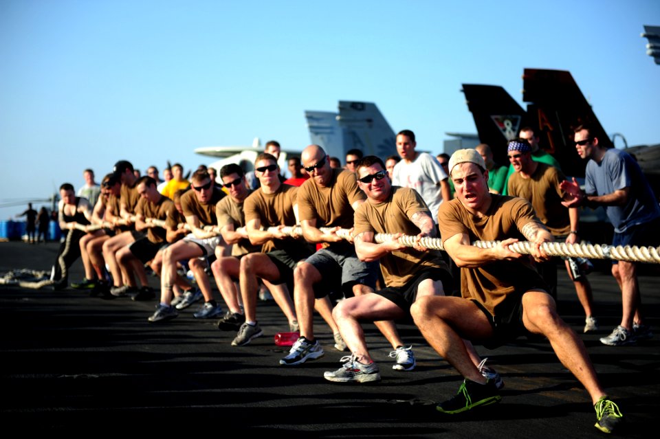 US Navy 111116-N-QL471-831 Sailors from Helicopter Sea Combat Squadron 9 compete in a tug of war challenge during a Captain's Cup competition on th