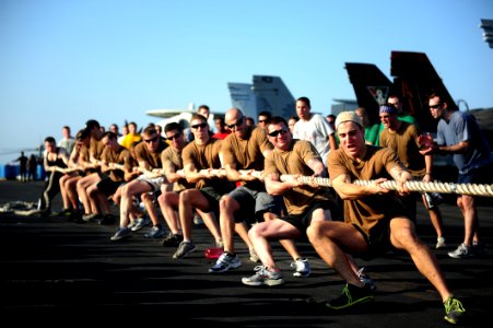 US Navy 111116-N-QL471-831 Sailors from Helicopter Sea Combat Squadron 9 compete in a tug of war challenge during a Captain's Cup competition on th
