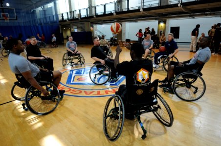 US Navy 111118-N-PM781-003 Service members from all branches of the military take part in a wounded warrior wheelchair basketball exhibition at the