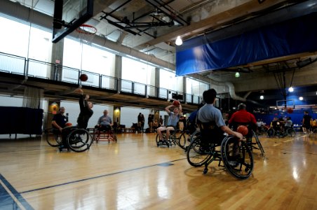 US Navy 111118-N-PM781-002 Service members from all branches of the military take part in a wounded warrior wheelchair basketball exhibition at the