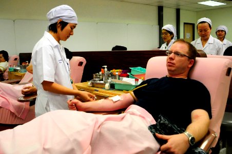US Navy 111118-N-WV964-027 Sailors from USS Lassen donate blood while supporting flood relief efforts in Thailand