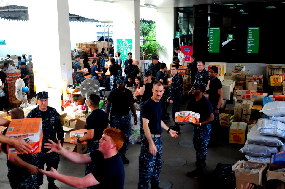 US Navy 111118-N-WV964-016 USS Lassen crew members provide assistance to flood victims in Thailand