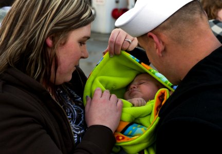 US Navy 111117-N-RG482-054 Boatswain's Mate 1st Class Samuel Siemers is reunited with his family after returning to Naval Station Everett from a si