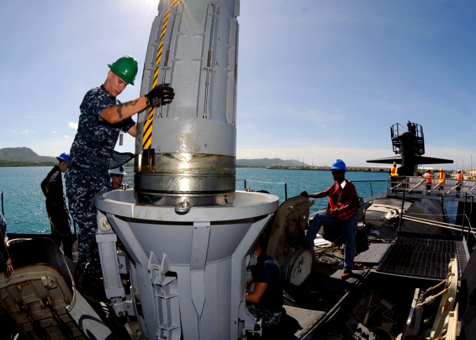 US Navy 111123-N-UE250-062 Gunner's Mate 2nd Class Damien Elser, assigned to the submarine tender USS Frank Cable (AS 40), guides a Capsule Launch