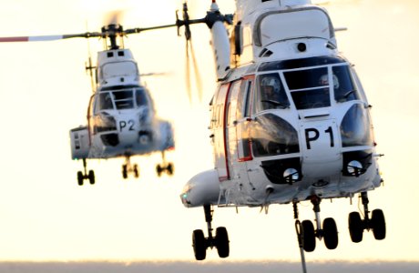 US Navy 111121-N-ZZ999-080 Helicopters transferring munitions