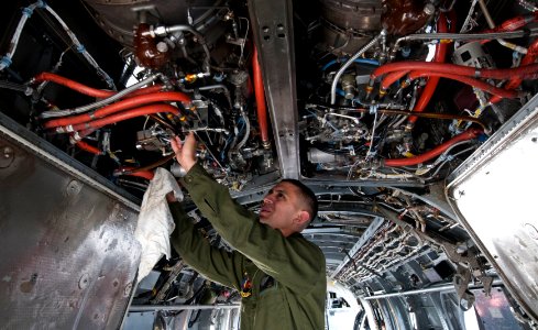 US Navy 111123-N-PB383-138 A Marine conducts maintenance inside a Corps CH-46E Sea Knight helicopter