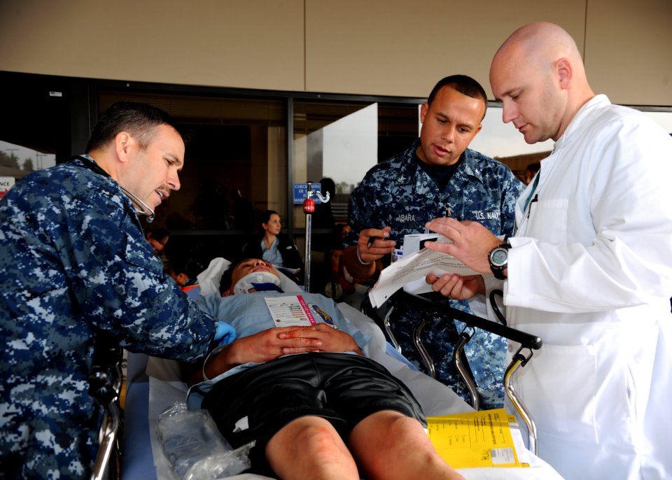 US Navy 111117-N-UB993-060 Staff reviewS patient information and injuries during drill.
