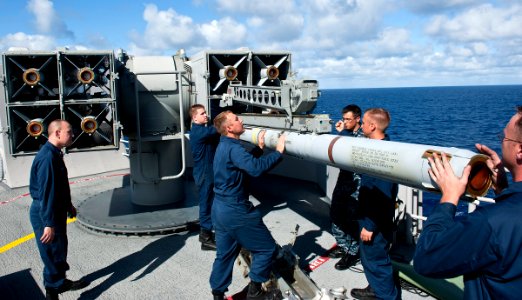 US Navy 111118-N-DX615-059 Fire controlmen load a RIM-7P NATO Sea Sparrow missiles into a Mk 29 Sea Sparrow launcher