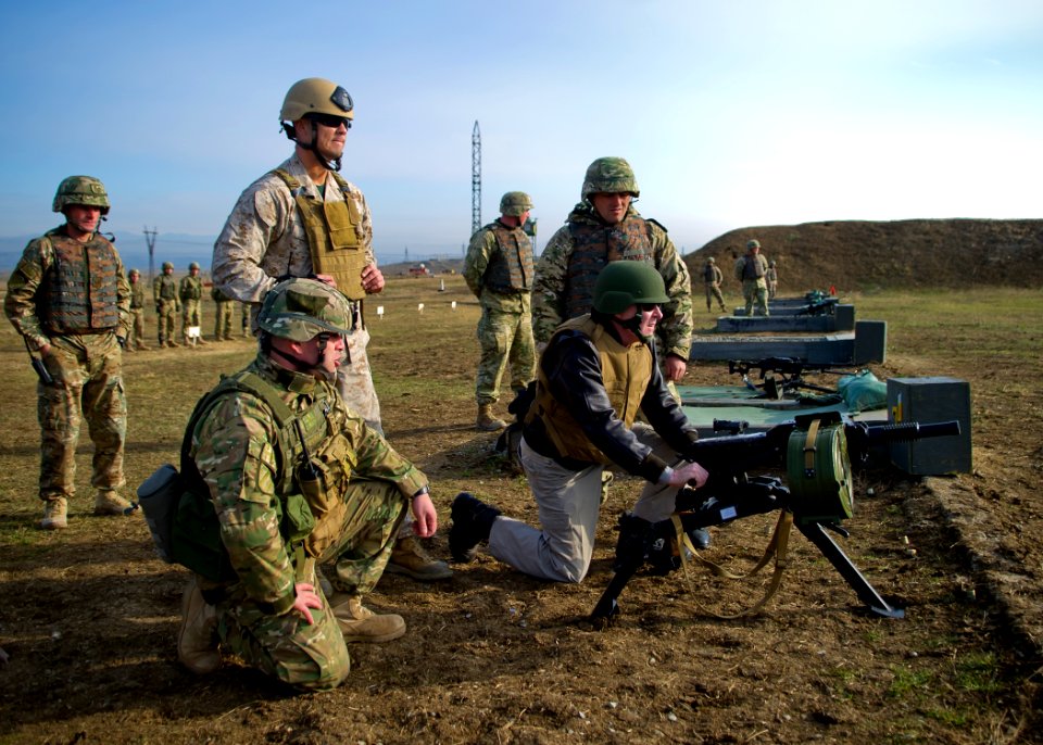 US Navy 111119-N-AC887-002 Secretary of the Navy (SECNAV) the Honorable Ray Mabus fires an AGS-17, Russian 30mm automatic grenade launcher at the K