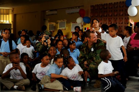 US Navy 111125-N-MN502-282 Steelworker 2nd Class Barron Montowski attends a recognition ceremony with students at Rafaela Santaella Elementary Scho