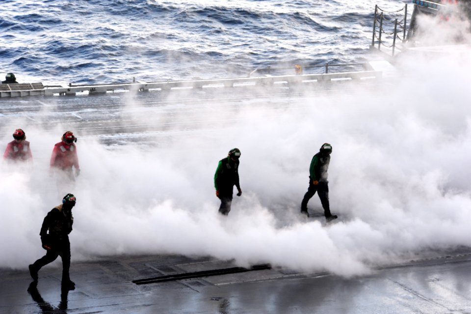 US Navy 111123-N-QL471-507 Sailors clear the catapult after a launch aboard the aircraft carrier USS George H.W. Bush (CVN 77)
