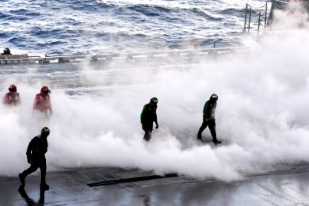 US Navy 111123-N-QL471-507 Sailors clear the catapult after a launch aboard the aircraft carrier USS George H.W. Bush (CVN 77)