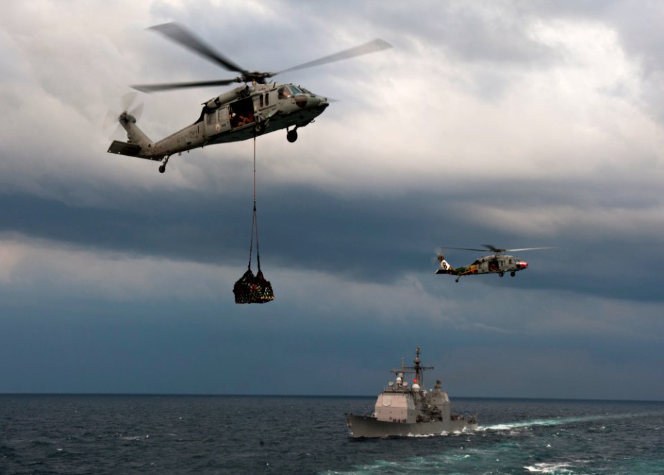 US Navy 111122-N-BT887-133 An MH-60S Sea Hawk helicopter assigned to the Eightballers of Helicopter Sea Combat Squadron (HSC) 8 lifts cargo