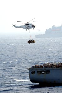 US Navy 111122-N-QL471-155 An SA-330J Puma helicopter carries cargo during a vertical replenishment with the aircraft carrier USS George H.W. Bush