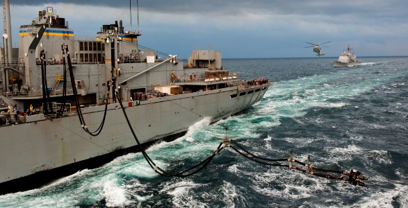 US Navy 111122-N-BT887-096 A double-probe fuel line extends from the Military Sealift Command fast combat support ship USNS Rainier (T-AOE 7)