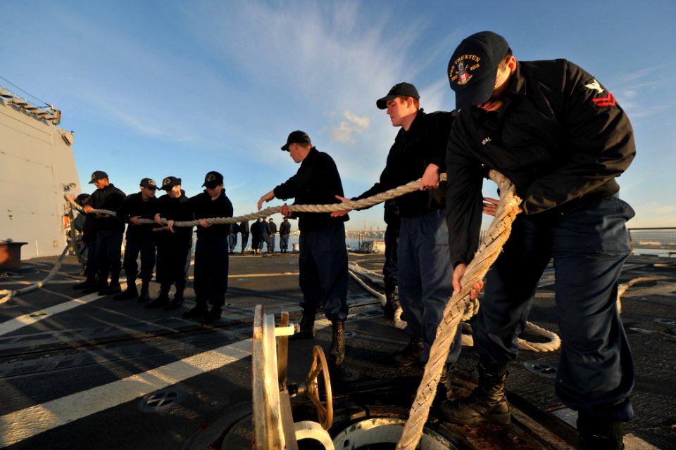 US Navy 111126-N-YZ751-025 Sailors aboard the guided-missile destroyer USS Truxtun (DDG 103) stow a handling line after departing Civitavecchia, It photo