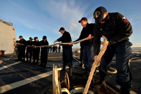 US Navy 111126-N-YZ751-025 Sailors aboard the guided-missile destroyer USS Truxtun (DDG 103) stow a handling line after departing Civitavecchia, It photo
