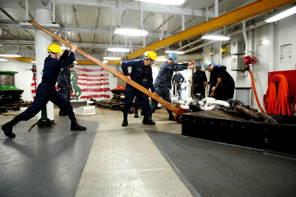 US Navy 111120-N-WA347-172 Sailors rig an anchor chain before dropping the anchor aboard the multi-purpose amphibious assault ship USS Essex (LHD 2