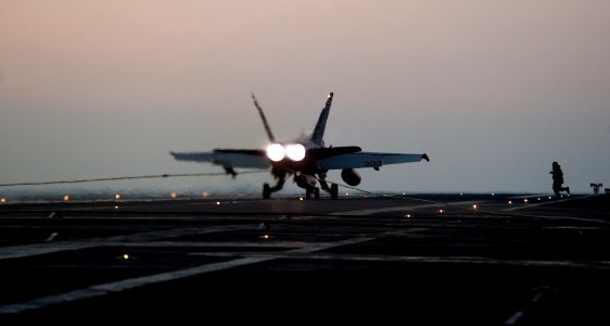 US Navy 111123-N-OY799-255 An F-A-18C Hornet from the Warhawks of Strike Fighter Squadron (VFA) 97 lands on the flight deck of the Nimitz-class air
