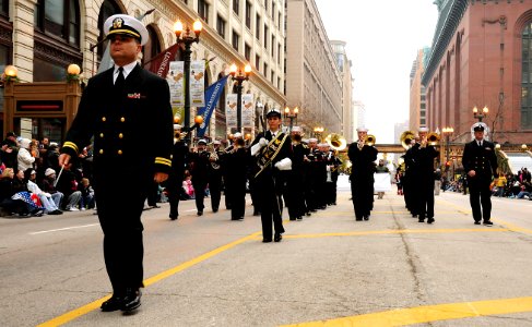 US Navy 111124-N-CD297-019 Lt. Patrick Sweeten, band director of the U.S. Navy Band Great Lakes, leads the marching band up State Street during the