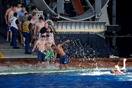 US Navy 111125-N-MW330-291 Sailors and Marines participate in a swim call from the multi-purpose amphibious assault ship USS Essex (LHD 2)