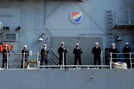 US Navy 111121-N-MU720-033 Sailors man the rails aboard the Ticonderoga-class guided-missile cruiser USS Cowpens (CG 63) as Cowpens