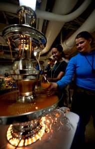 US Navy 111124-N-OY799-148 Sailors fill their glasses from a drink fountain during the Thanksgiving meal on the mess decks aboard the Nimitz-class
