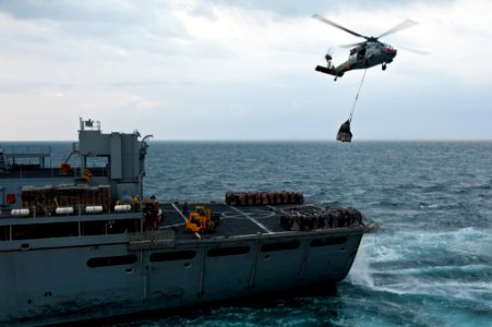 US Navy 111122-N-BT887-031 An MH-60S Sea Hawk helicopter assigned to the Eightballers of Helicopter Sea Combat Squadron (HSC) 8 lifts cargo